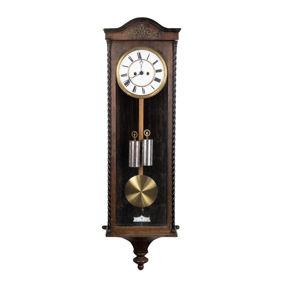 Antique-style wooden wall regulator clock with an oval pendulum and a white face showing black Roman numerals and hands.