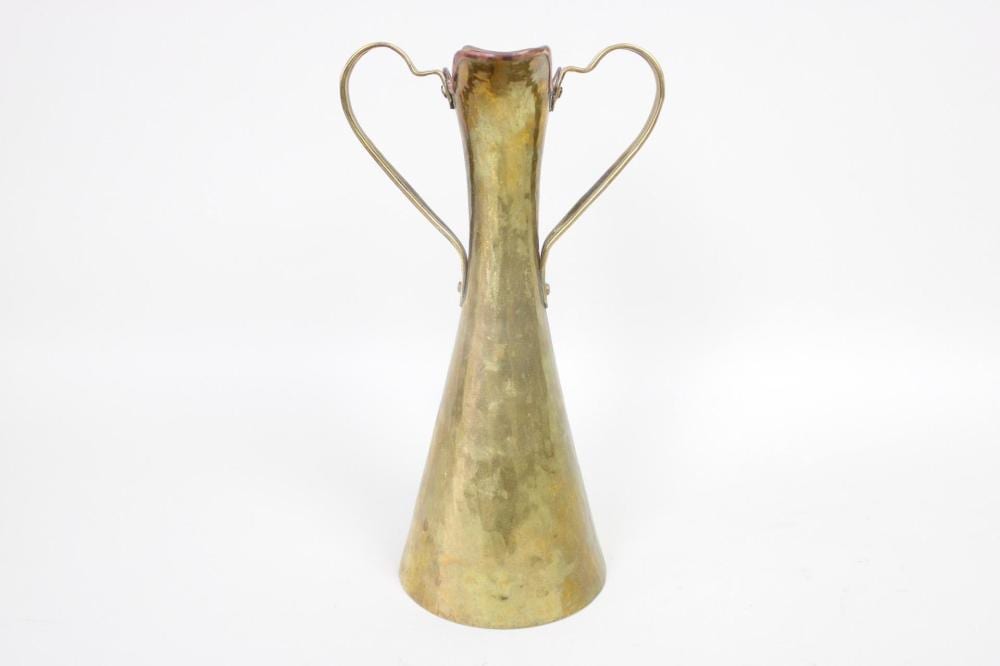 Brass vase or pitcher with a narrow neck and flared base, featuring two curved loop handles and a dark rim opening.
