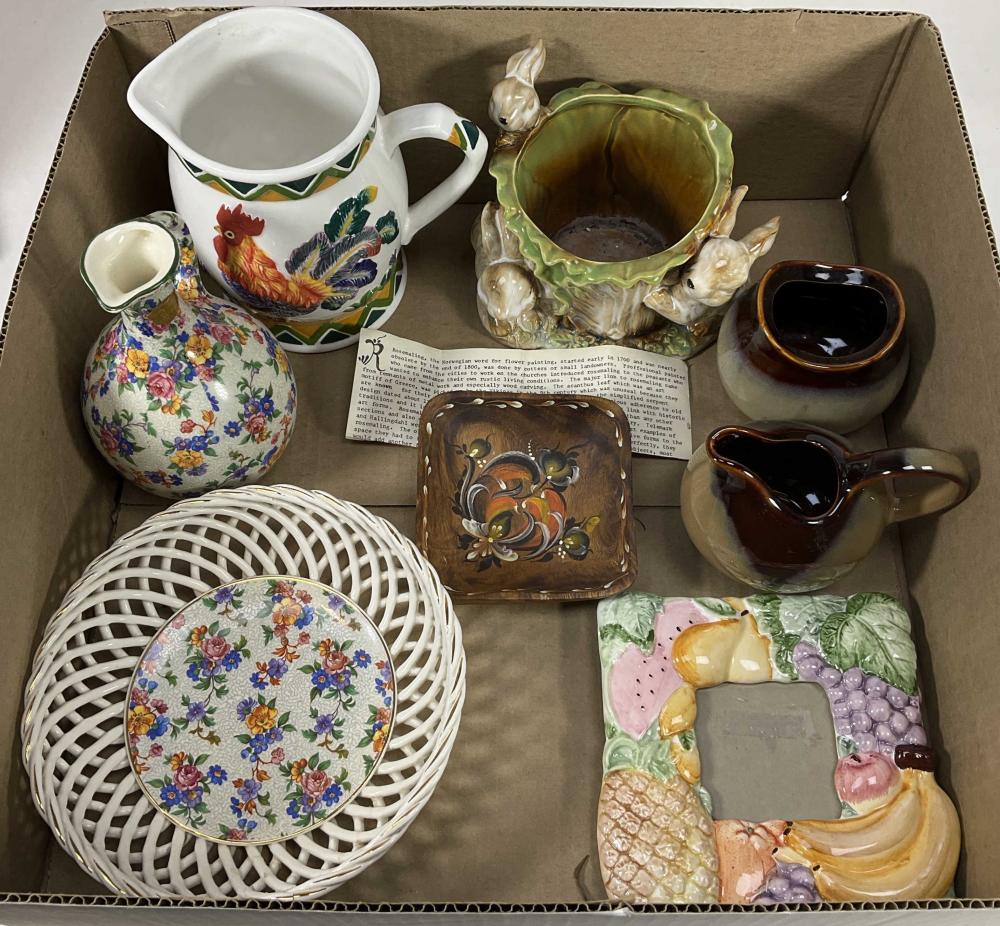 Photo of a ceramic floral wash basin set in a cardboard box, including a pitcher, bowl, and matching decorative plates and cups.