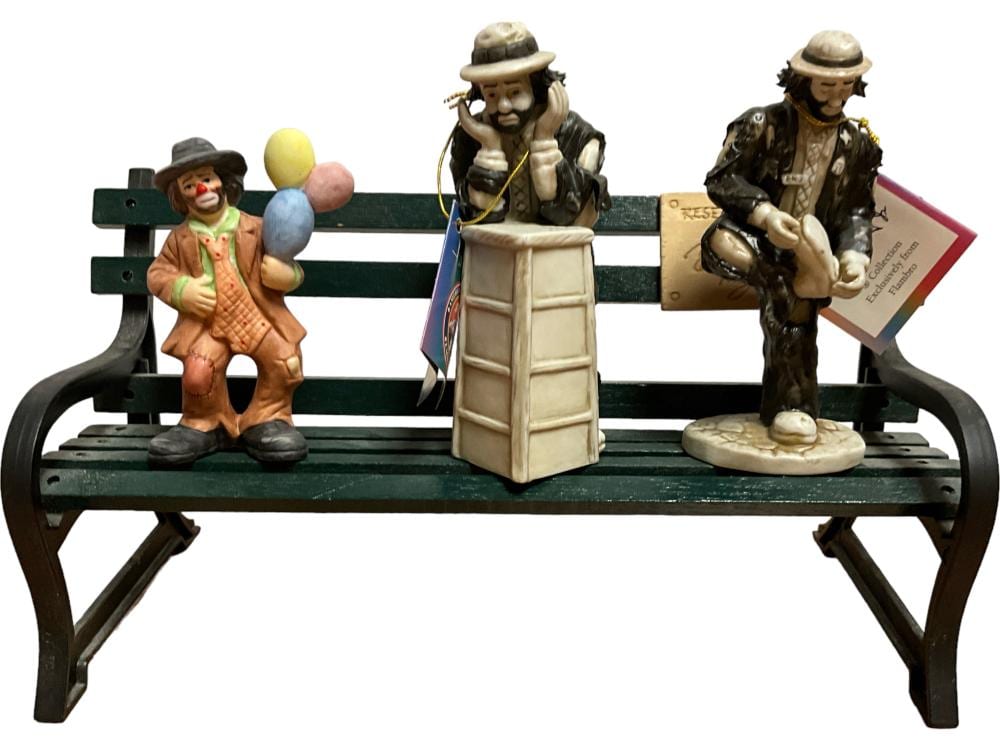 (4) Emmett Kelly Jr. Figurines and Park Bench sold by Apple Tree Auction Center, lot 153 — auction record photograph