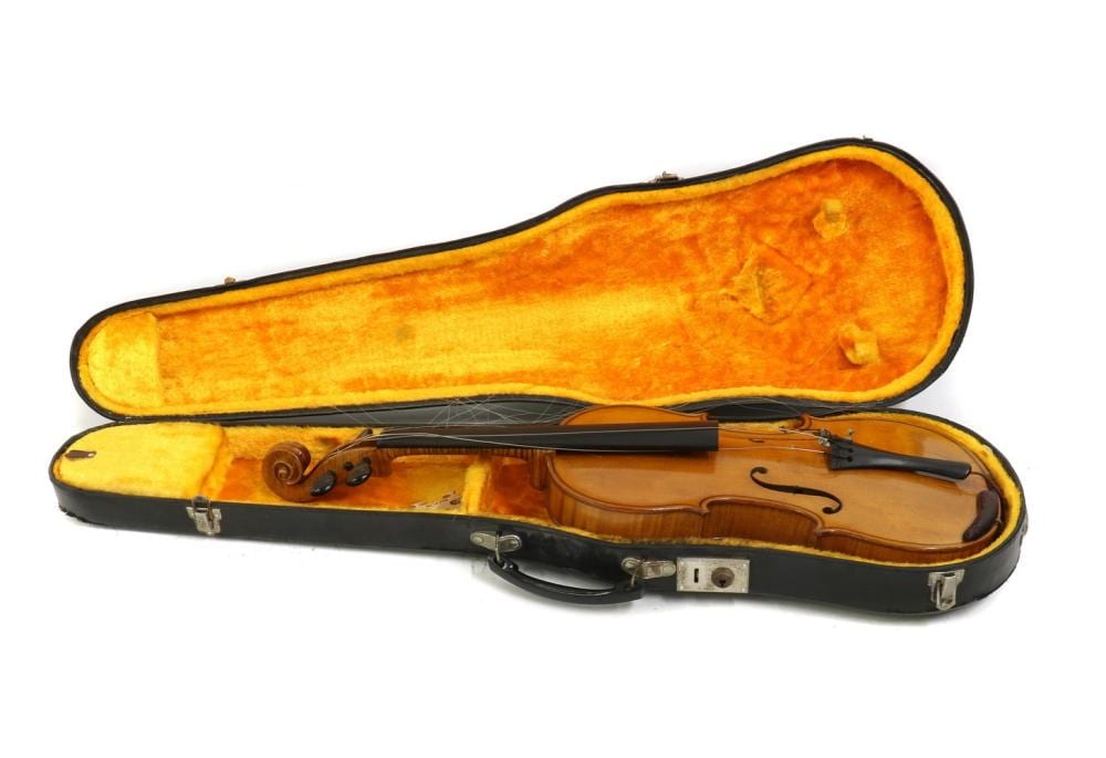 Closed violin case with a wooden violin visible inside, viewed on a white background.
