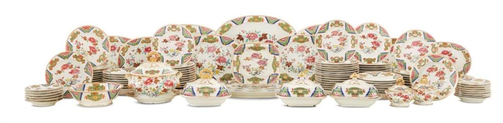 Assorted floral patterned dinnerware sets arranged on a white background, including plates, bowls, and cups with gold trim.