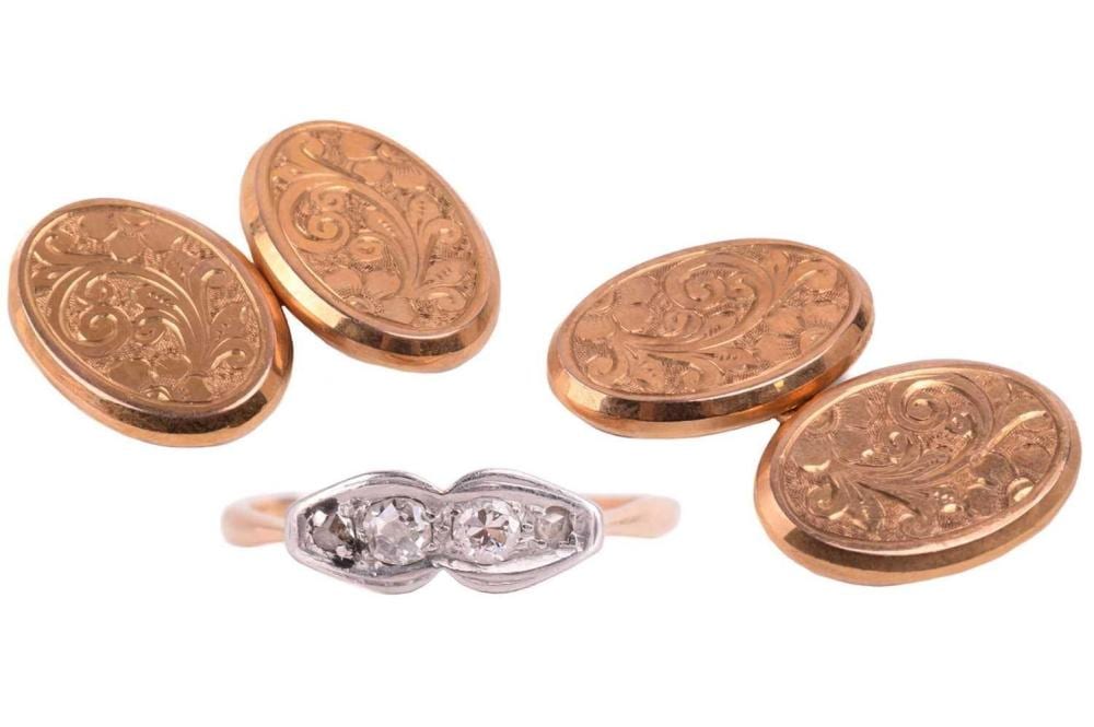 A pair of gold cufflinks, the oval plaques foliate engraved, with chain link connections, with hallmarks for 9ct gold and the date letter for 1911, together with a four stone diamond ring set with old cut and rose cut diamonds with a total... sold by Dawsons Auctioneers, lot 206 — auction record photograph