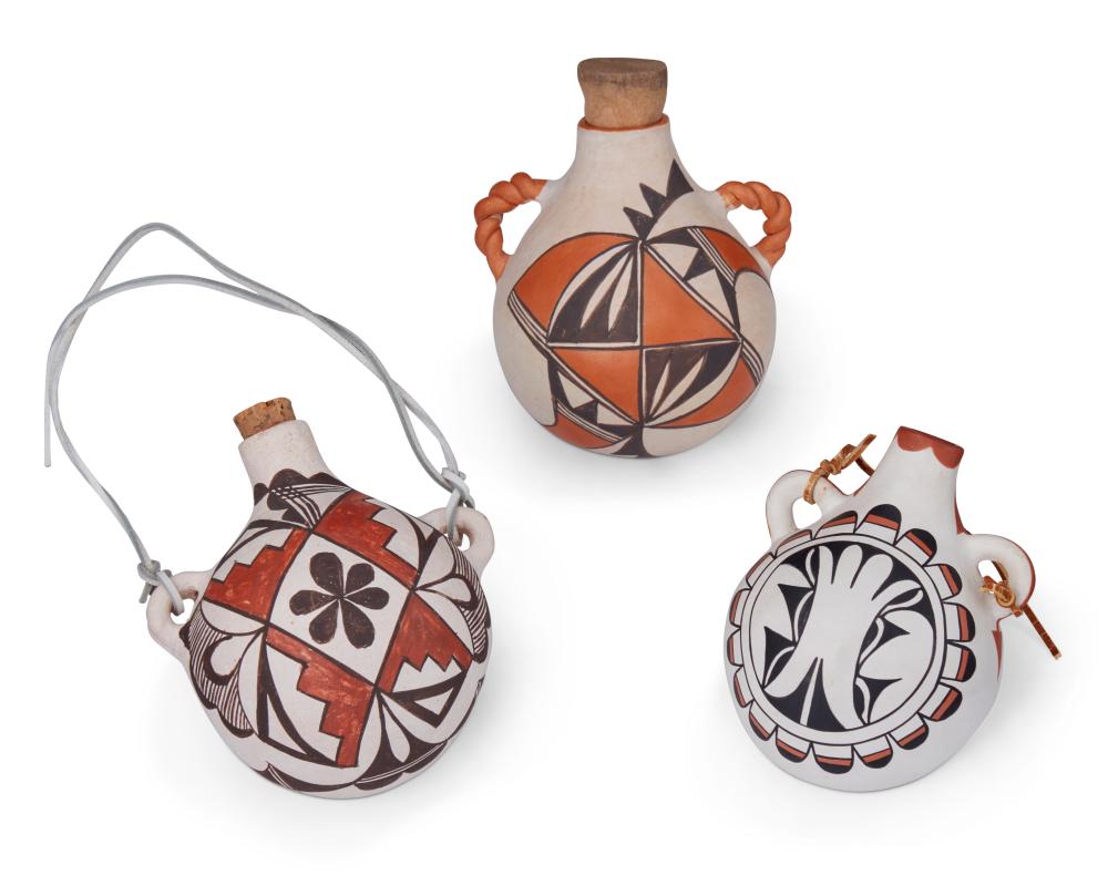 Juana Leno comparable auction result: a group of puebloan pottery canteens