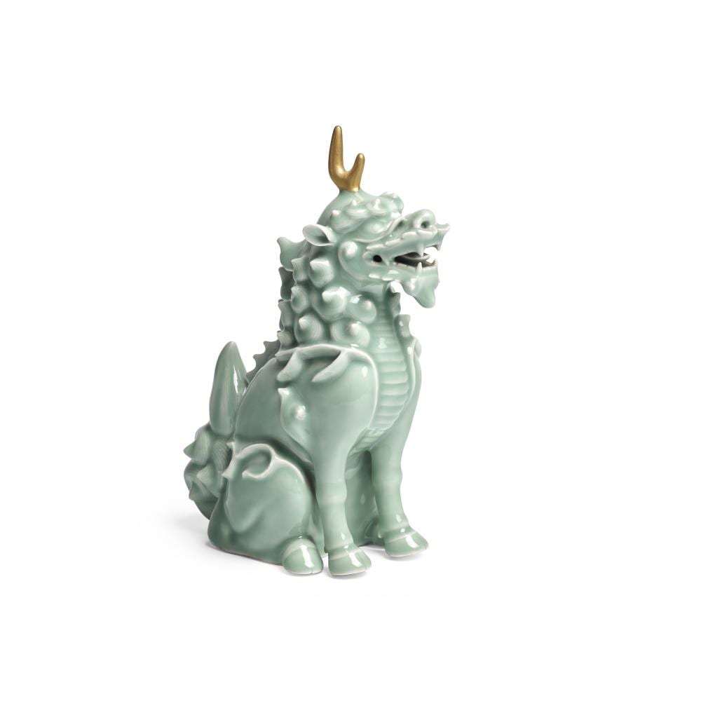 Ceramic incense burner shaped like a standing kirin or dragon with a green-blue glaze and golden horn-like finial on top.