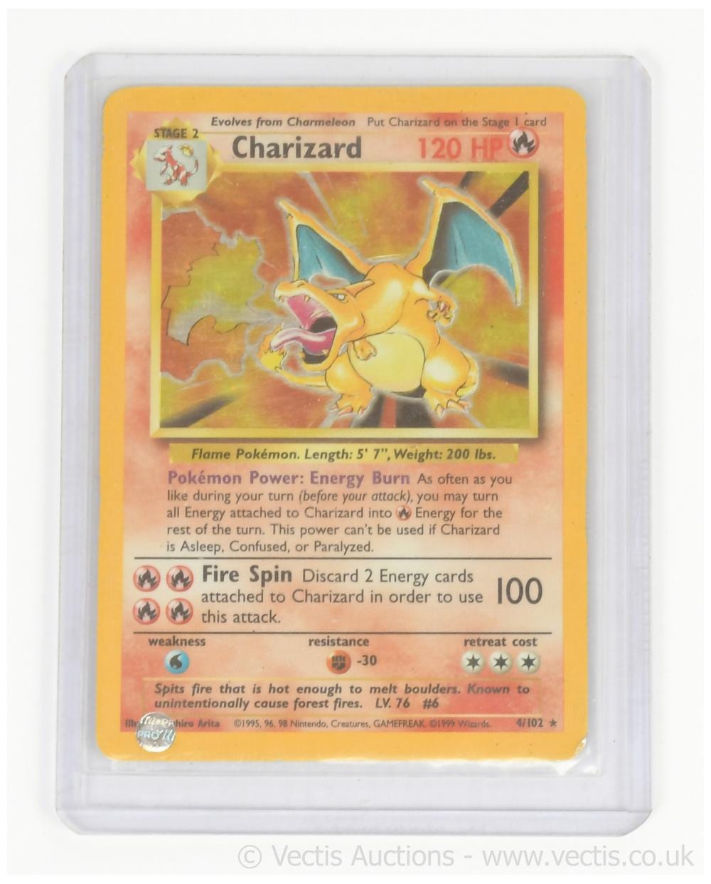 Pokemon trading card featuring Charizard with “120 HP” and fire-themed artwork, shown in a clear plastic holder.