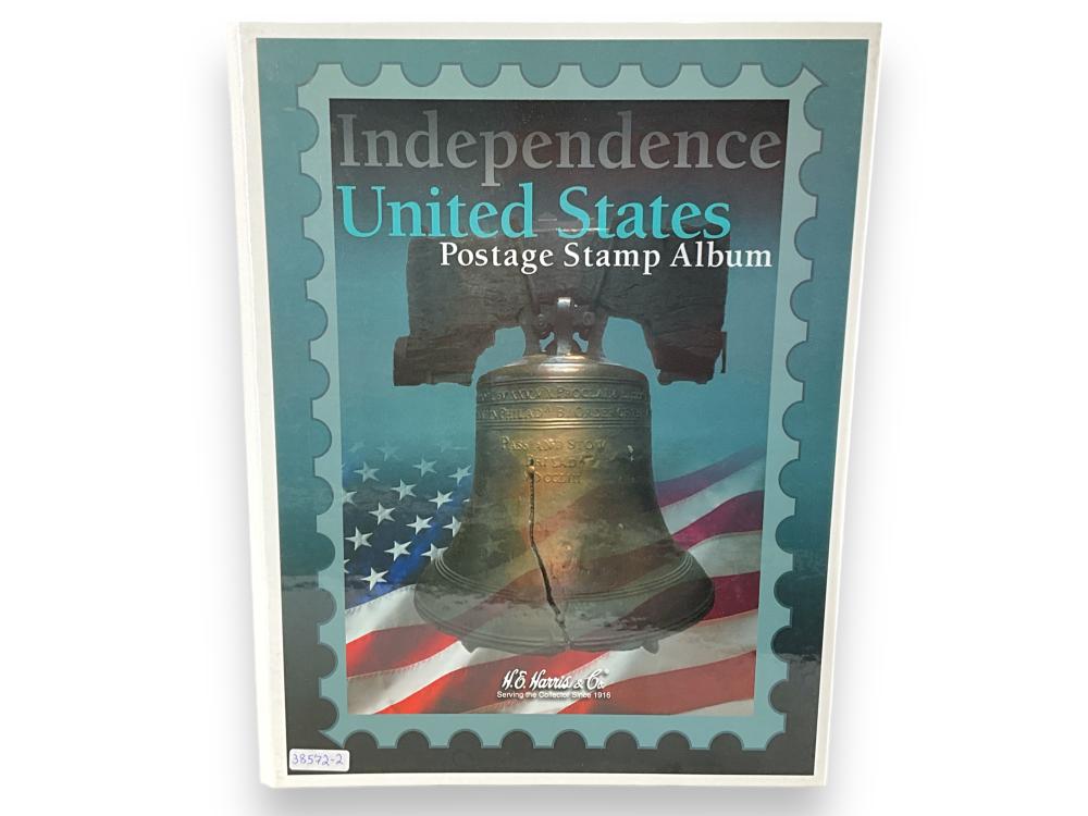 Cover of an Independence United States postage stamp album with a bell, U.S. flag, and stamp-shaped border design.