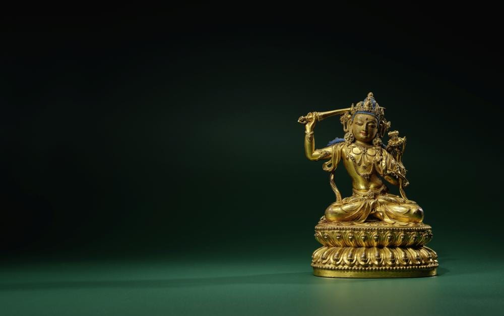 A Gilt Copper Alloy Figure Of Manjushri Ming Dynasty, Yongle Six-Character Mark And Of The Period (1403-24) comparable sale