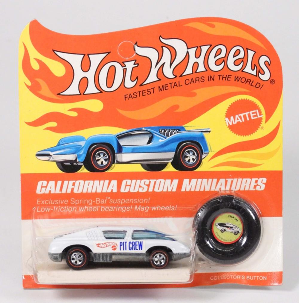 Hot Wheels boxed toy car with blue and silver “California Custom Miniatures” artwork and a small accessory on the right.