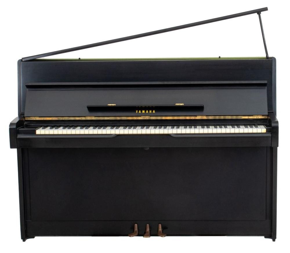Front view of a black upright Yamaha piano with keys and lid raised, showing the keyboard and front panel.