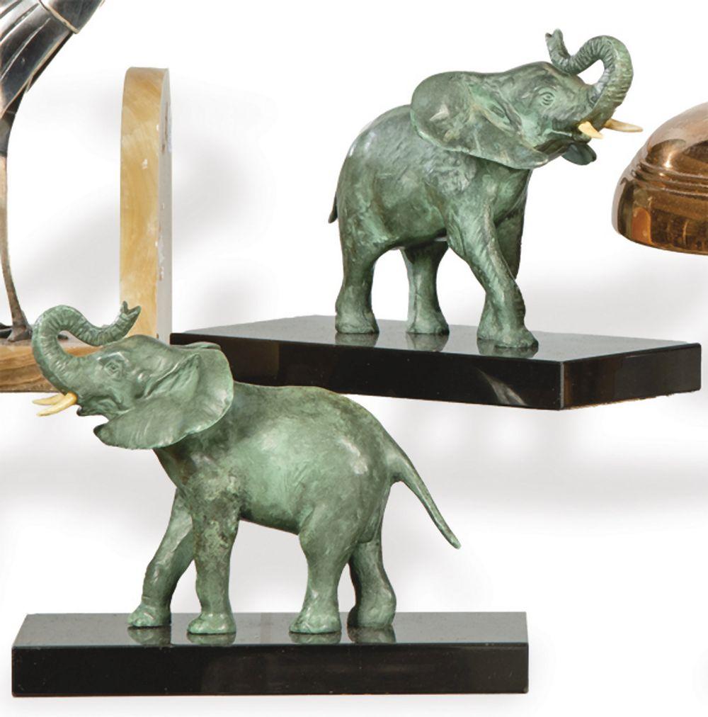 Georges Raoul Garreau comparable auction result: georges raoul garreau france 1885 1954 pair of art deco bookends in patinated metal and black marble from belgium signed on the base