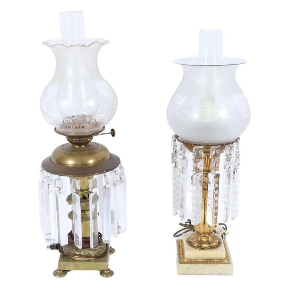 Pair of antique brass converted electric hurricane table lustre oil lamps with hanging crystal prisms. 23"H x 7"Diam. (largest) sold by Ripley Auctions, lot 105 — auction record photograph