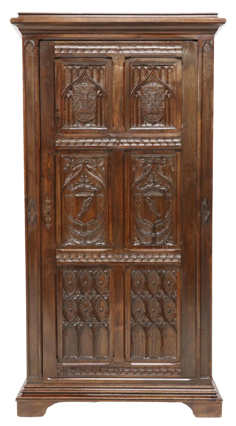 FRENCH GOTHIC REVIVAL ARMORIAL CARVED OAK ARMOIRE sold by Austin Auction Gallery, lot 840 — auction record photograph