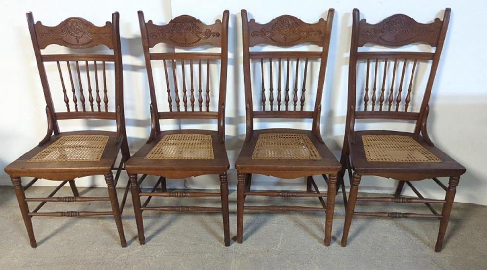 (4) Antique Oak pressback cane seat chairs sold by Heritage Antiques & Auction, lot 181 — auction record photograph
