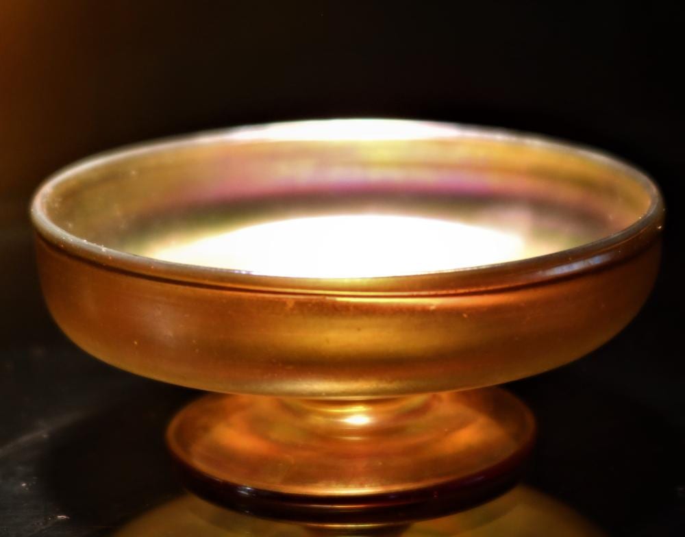 Leopoldo de Almeida comparable auction result: l c tiffany signed shallow footed bowl favrile gold glass