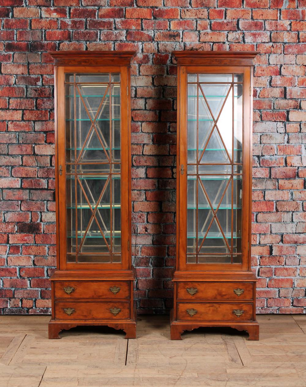 PAIR ANTIQUE ENGLISH GUN CABINETS TURNED VITRINES sold by Ashcroft and Moore, lot 77 — auction record photograph