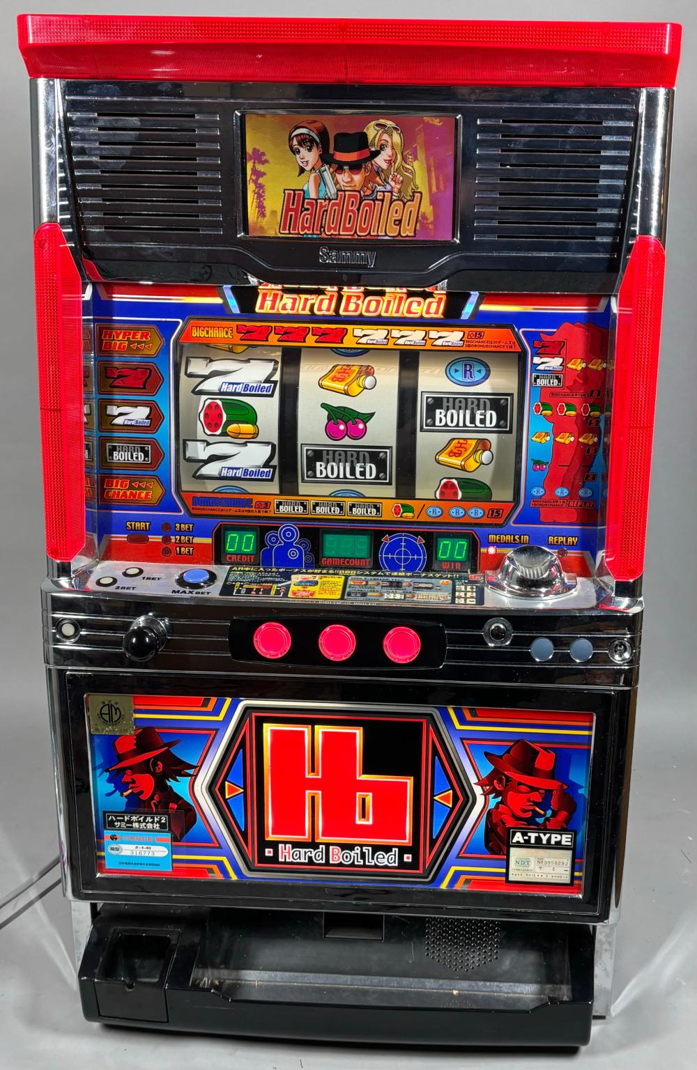 Front view of a red-and-black “Hard Boiled” Japanese slot machine with character graphics, reels, and control buttons.