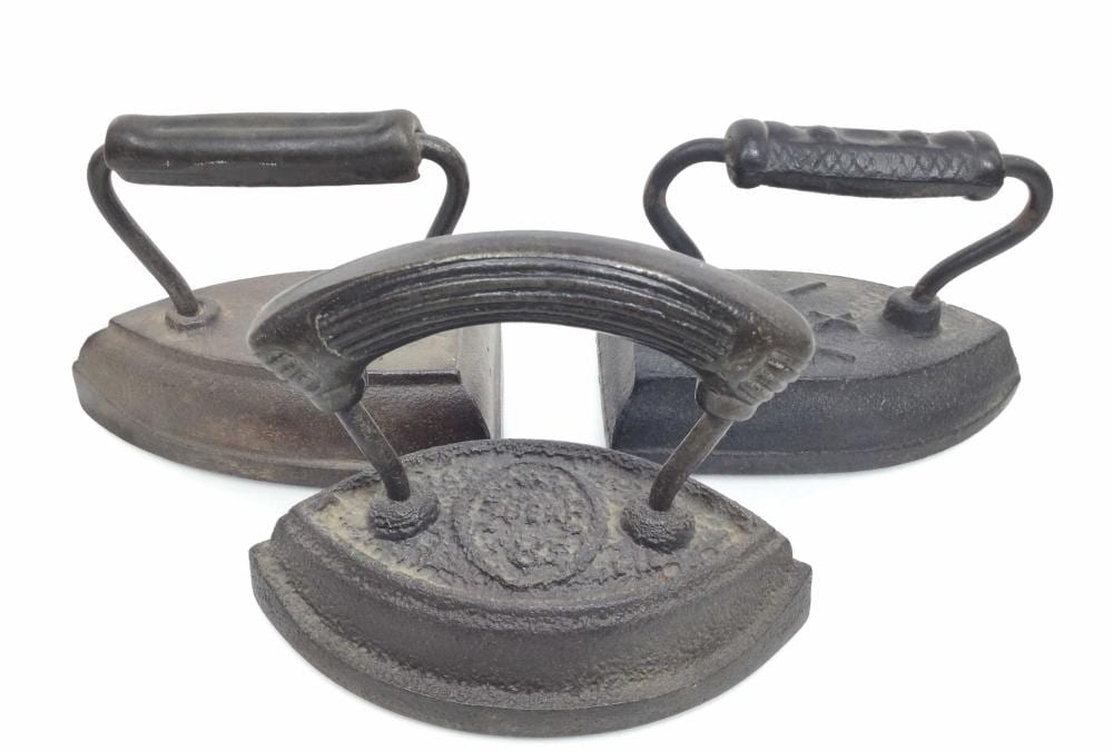 (3) Antique Cast Iron Sad Irons sold by EJ'S Auction & Appraisal, lot 2249 — auction record photograph
