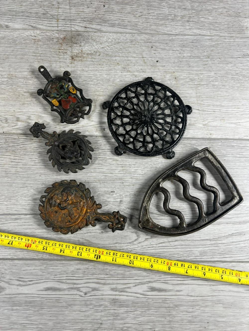 5- Cast Iron Trivets sold by Air Works Consignment Auction Ltd., lot 11378 — auction record photograph
