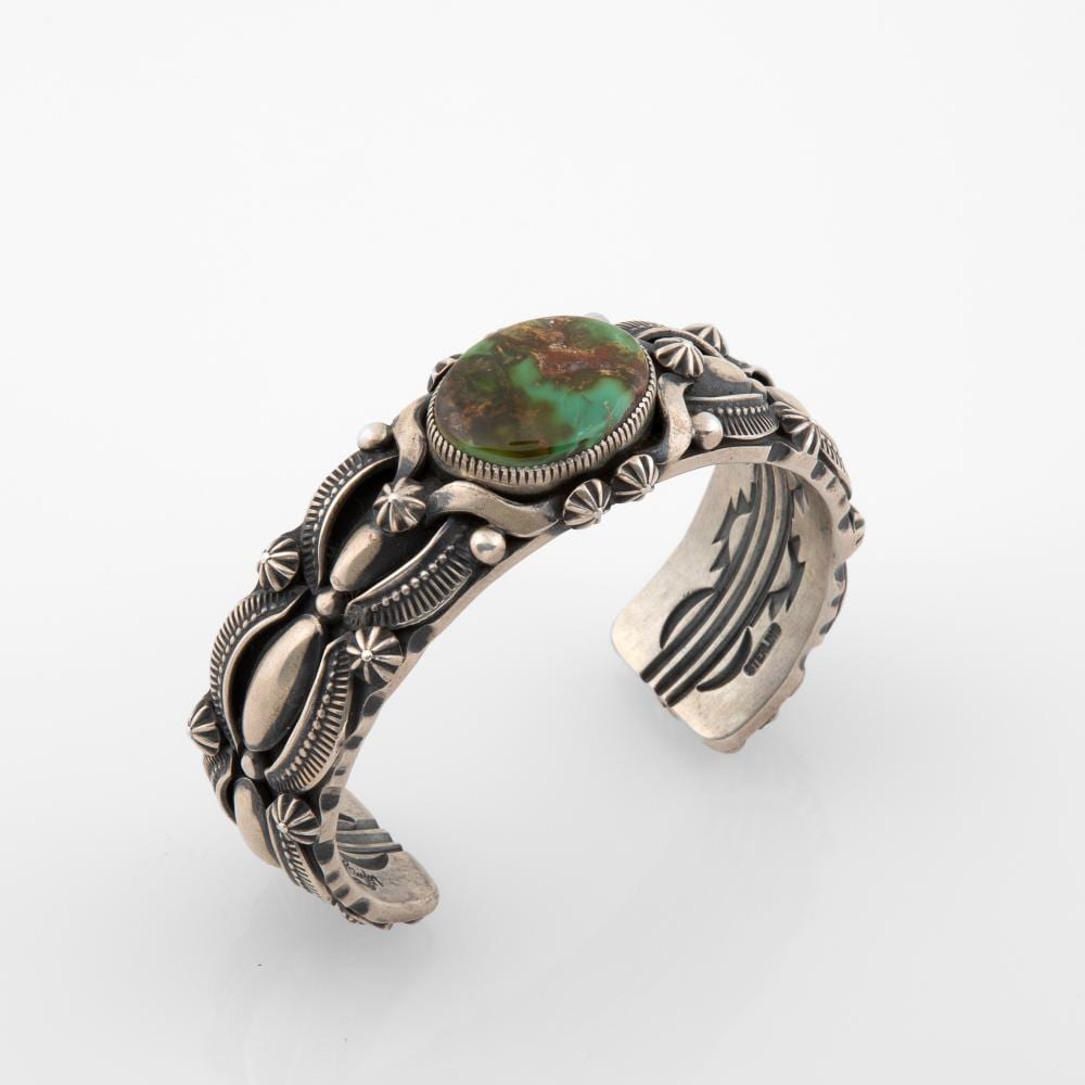 Delbert Gordon comparable auction result: delbert gordon silver cuff with turquoise cabochon