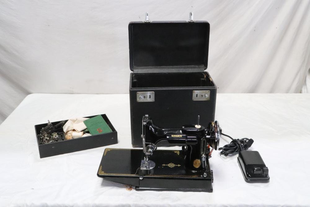 A Singer featherweight sewing machine sold by International Auction Gallery, lot 49 — auction record photograph