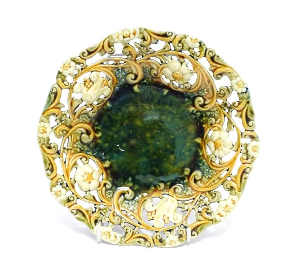 Frans Xaver Hendrik Verbeeck comparable auction result: a linthorpe majolica plate with mottled green glaze to centre bordered by f
