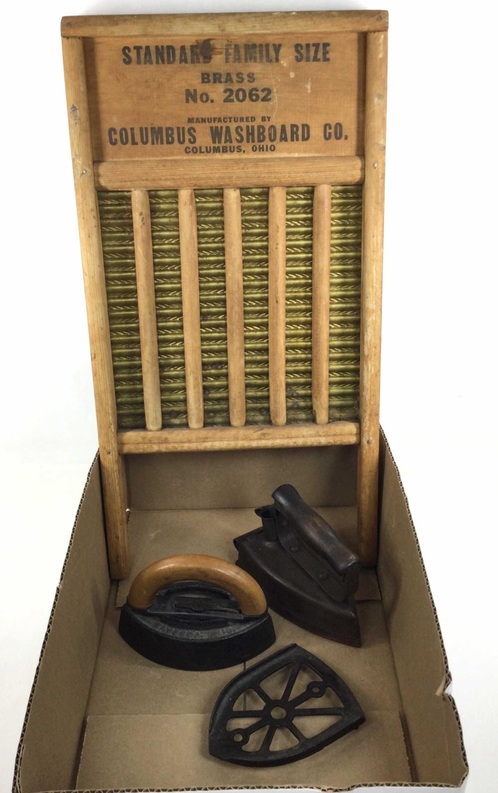 (4pc) Vintage Washboard, Irons, Trivet sold by EJ'S Auction & Appraisal, lot 3195 — auction record photograph