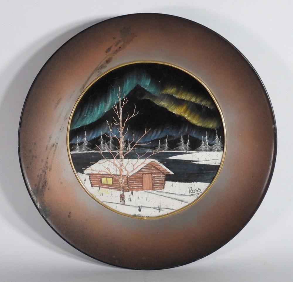 Circular framed winter landscape painting with a small house in the snow, leafless tree in the foreground, and mountains in the background.