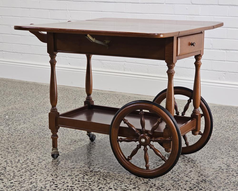 Italian beech drop side bar cart with wagon wheels (73 x 92 x 42 extended 93cm) sold by Lawsons, lot 1258 — auction record photograph