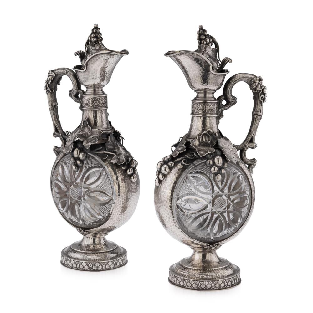 A MASSIVE PAIR OF 19TH CENTURY GERMAN SILVER AND GLASS CLARET JUGS, C.1890 sold by Curated Auctions, lot 128 — auction record photograph