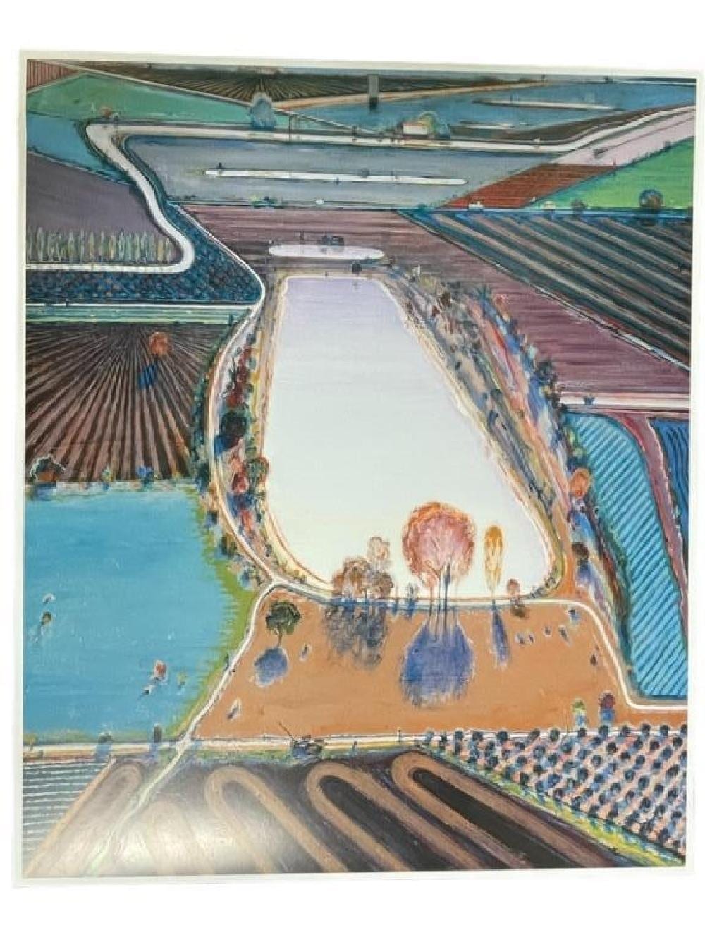 Color offset lithograph print showing a canal with a boat in the foreground, waterfront buildings, and green fields under a blue sky.