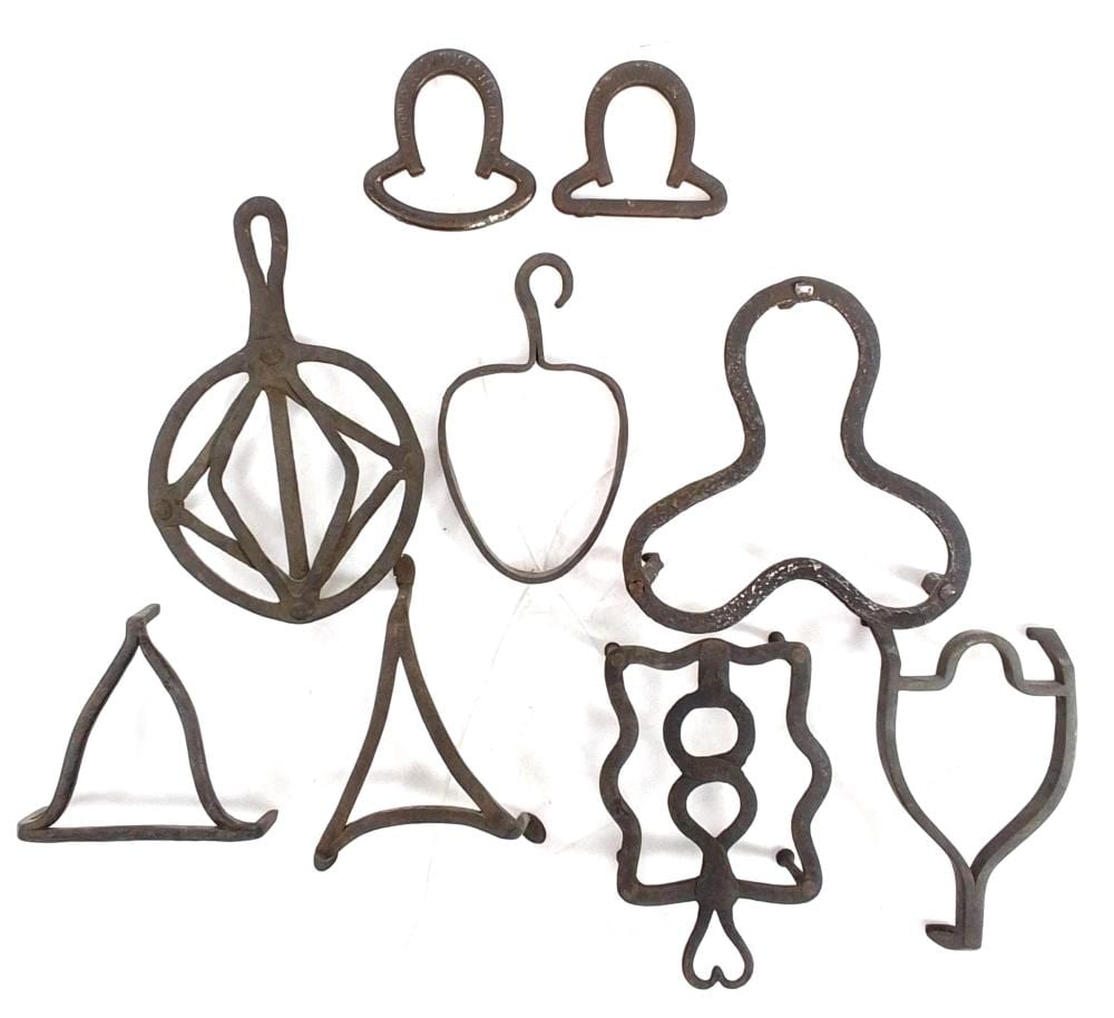 (7) Cast Iron Sad Iron Trivets & Horseshoes sold by EJ'S Auction & Appraisal, lot 3086 — auction record photograph