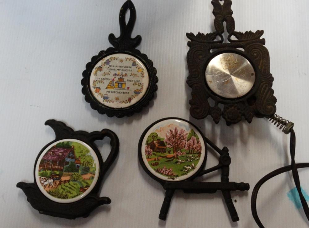 3 Vintage Cast Iron Trivets +1 Cast Iron Food Warm sold by California Auction Company LLC, lot 12 — auction record photograph