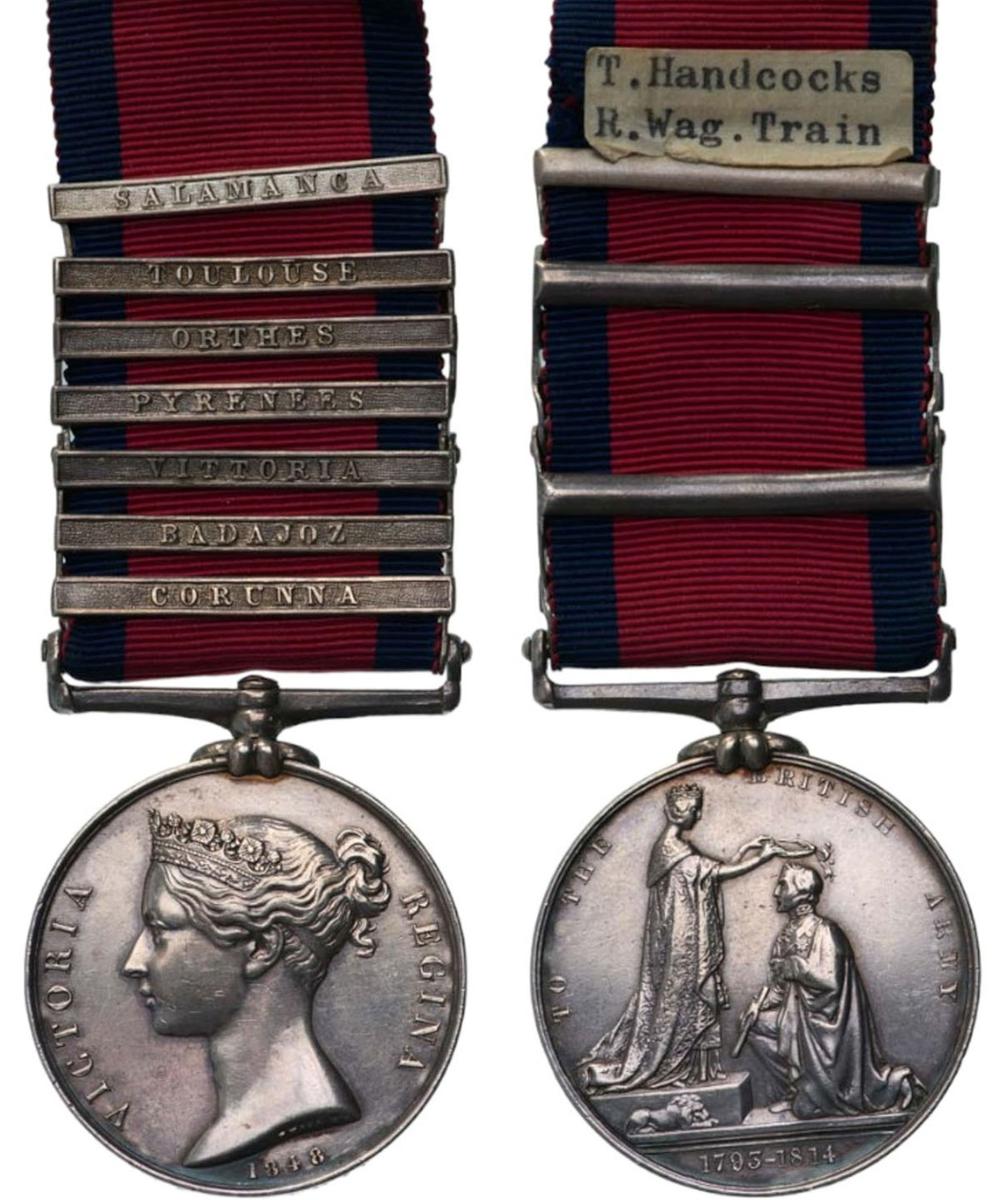 Close-up of two British military general service medals with blue-and-red striped ribbons and engraved date bust medallions.