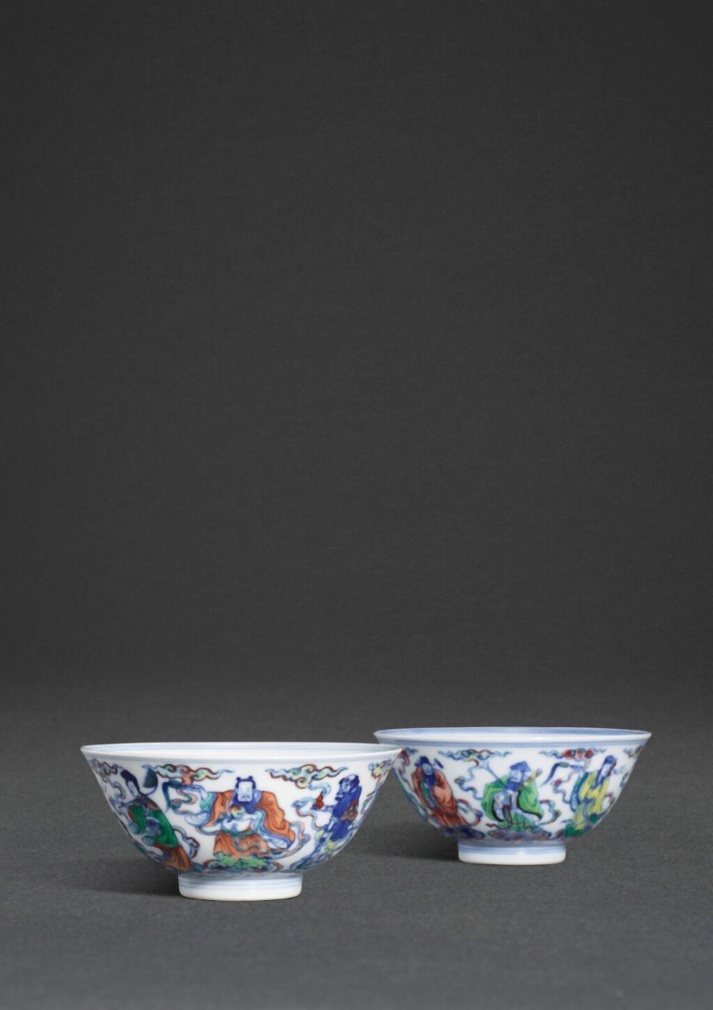 A fine and rare pair of doucai 'immortal' bowls, Marks and period of Yongzheng | 清雍正 鬪彩八仙過海盌一對 《大清雍正年製》款 comparable sale