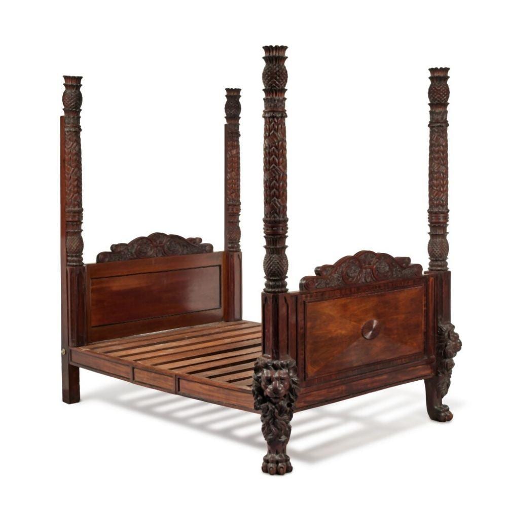 A Carved Mahogany and Ebonised Four Poster Bed with Pineapple Finials, possibly British West Indies, mid-19th Century sold by Sotheby's, lot 200 — auction record photograph