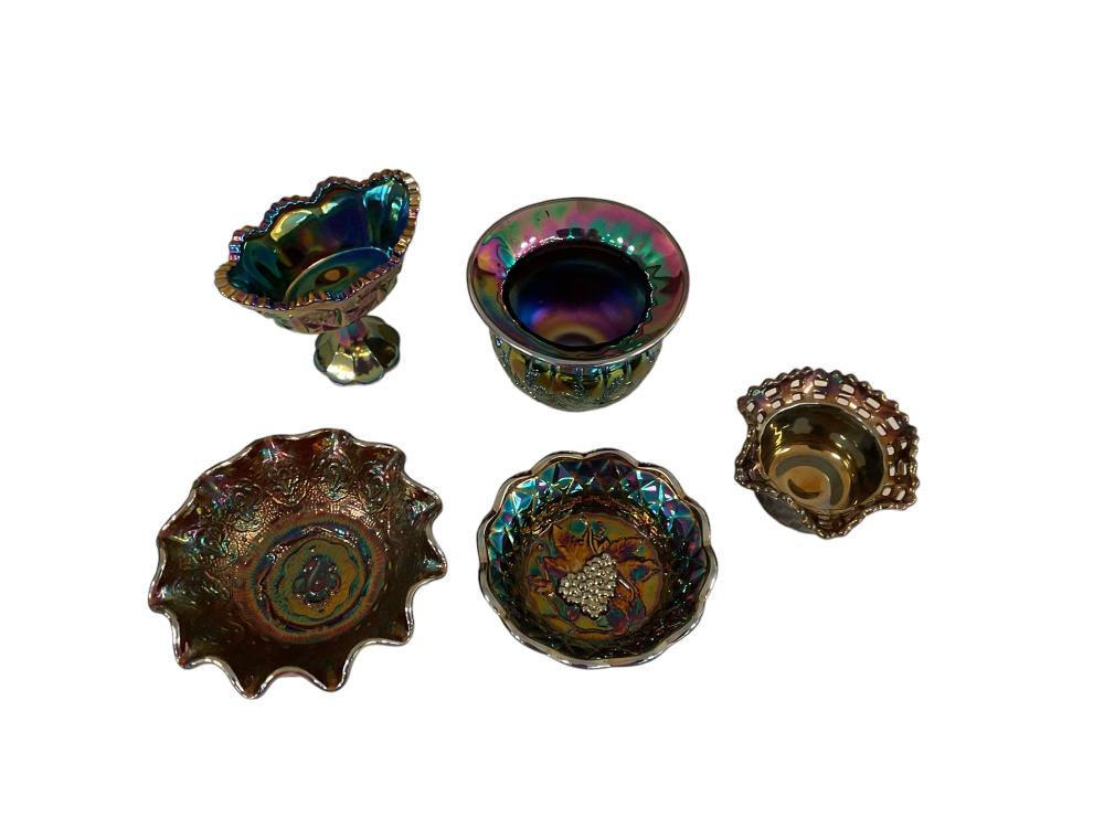 Six pieces of iridescent carnival glass bowls and dish-like forms with scalloped edges, shown on a white background.