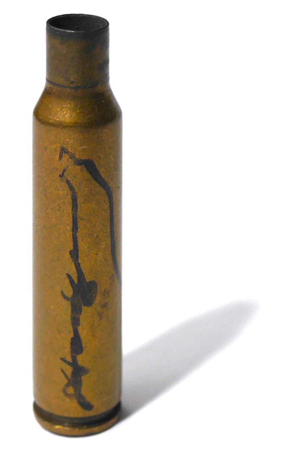 Warhol, Andy; RARE SIGNED BULLET [FROM THE 1982 "GUNS, KNIVE, CROSSES" EXHIBIT OPENING IN MADRID, SPAIN] sold by Bucklin, lot 104 — auction record photograph