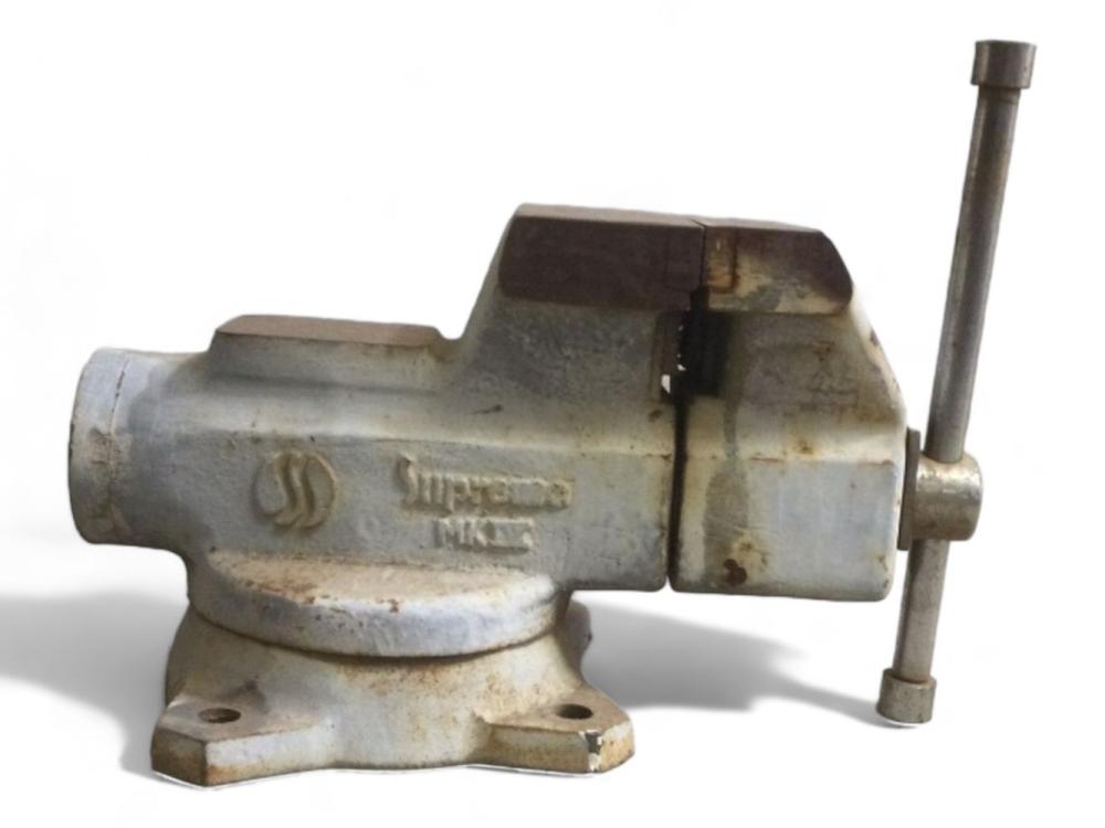 Metal bench vise tool with a screw rod extending upward, shown against a white background.
