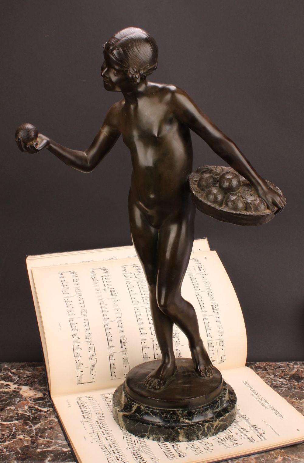 jean verschneider 1872 1943 a brown patinated bronze ripening fruit signed in the maquette retailed by etling paris verde antico marble base 57 5cm high overall · Bamfords Auctioneers and Valuers Ltd · 2024-05-02 Jean Verschneider comparable auction result: jean verschneider 1872 1943 a brown patinated bronze ripening fruit signed in the maquette retailed by etling paris verde antico marble base 57 5cm high overall