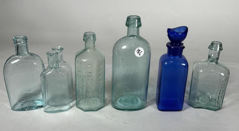 EIGHT ANTIQUE BOTTLES sold by Kimball's Auction, lot 186 — auction record photograph
