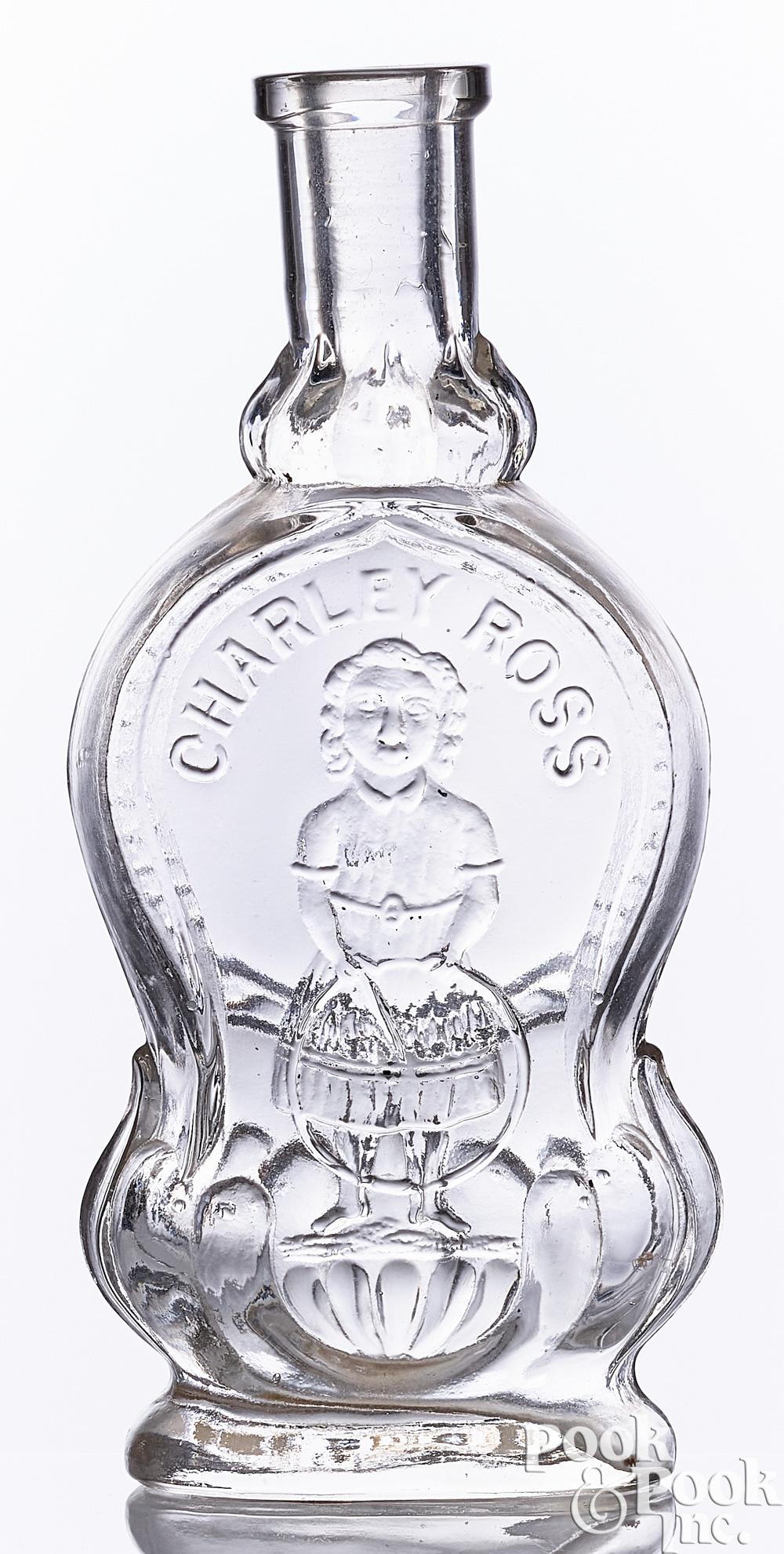Charley Ross embossed clear glass perfume bottle sold by Pook & Pook Inc., lot 317 — auction record photograph