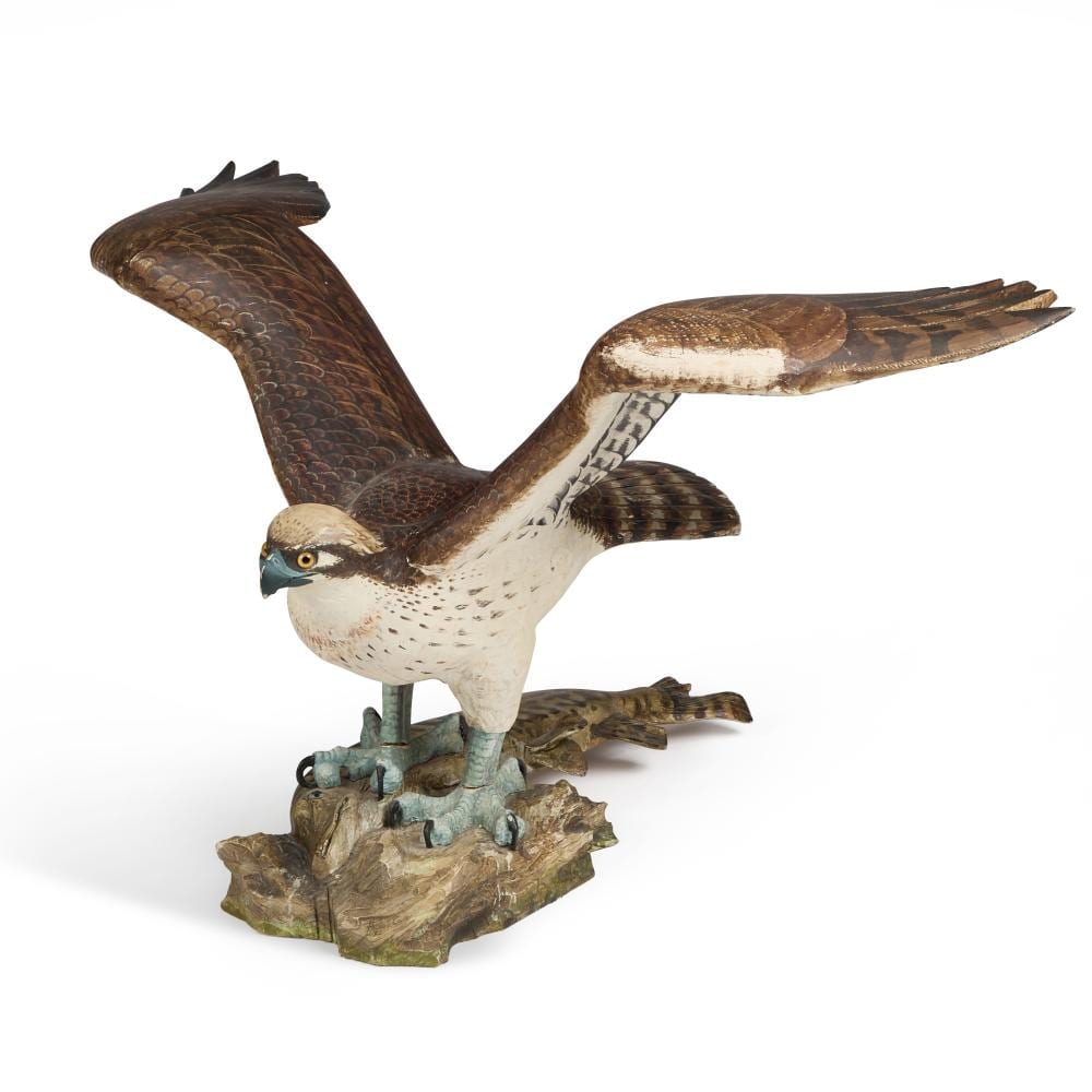 Howard Carter comparable auction result: howard carter a carved and painted wooden model of an eagle with a pike in it s talons
