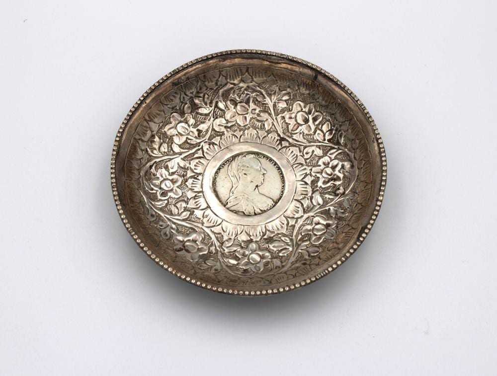 A silver bowl inset with a silver 1780 Maria Theresa Thaler coin sold by Martel Maides, lot 604 — auction record photograph