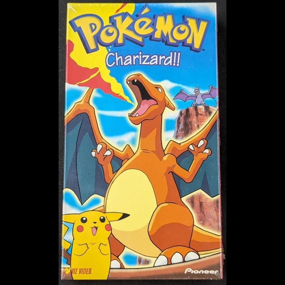 Pokémon “Charizard!!” VHS tape cover featuring Charizard, Pikachu, and the Pokémon logo in colorful artwork.