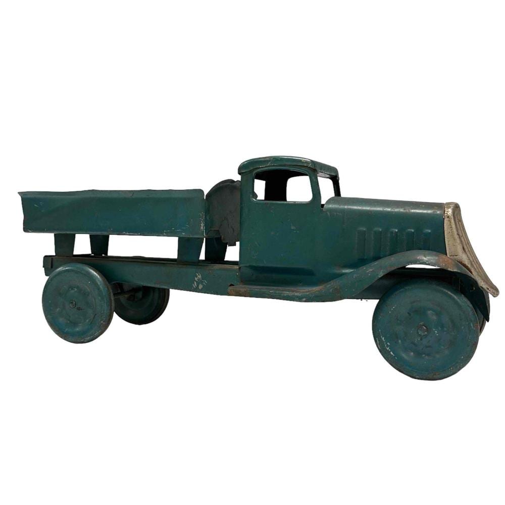 Green pressed-steel toy truck with an open bed and front cab, shown side view with four wheels.