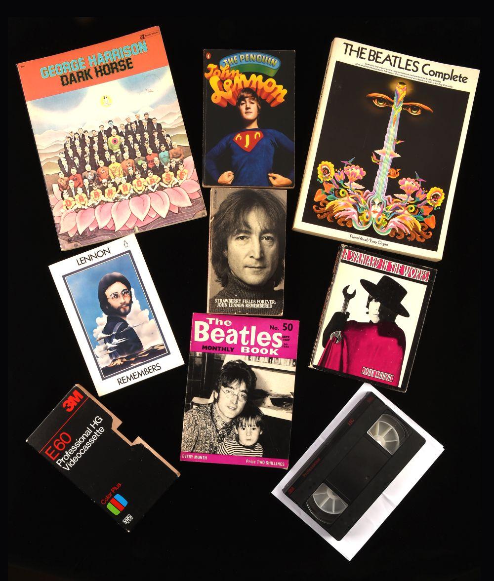 Collection of five Beatles-related items on a black background, including VHS cassette cases and printed book covers with portraits and album-style artwork.