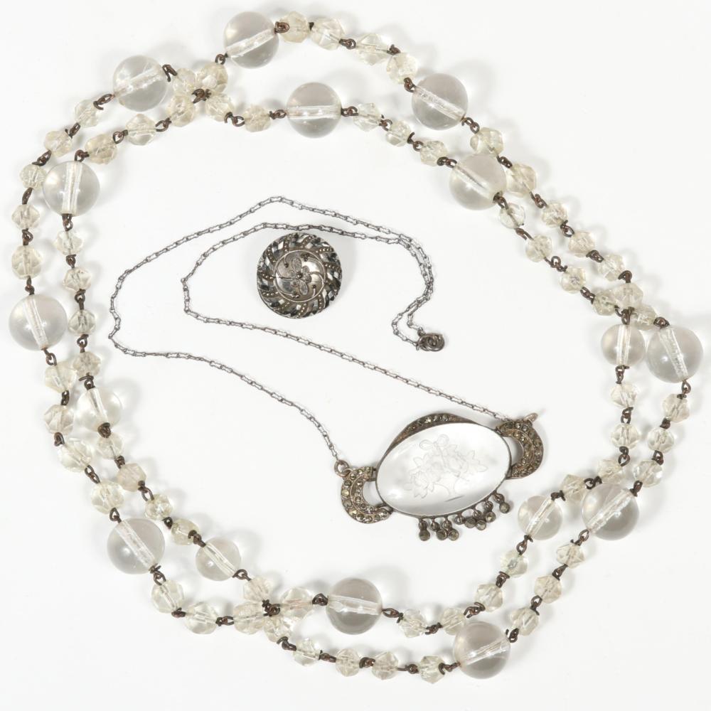 Auction comp thumbnail for Vintage Art Deco 3pc jewelry group with long rock crystal pools of light necklace, marcasite and clear glass intaglio flower bouquet necklace with sterling silver clasp, and glass button brooch 19"L x 1 3/8"Drop (marcasi (Ripley Auctions, Lot 86)