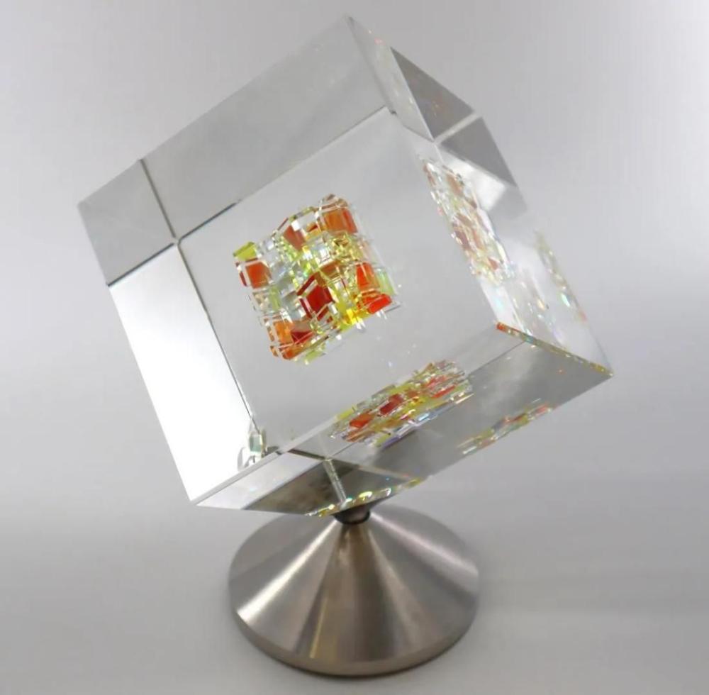 Jon Kuhn (American, B. 1949), 'Golden Sun 2024' 5 Layers Glass Art Cube Sculpture, Rotating Base sold by Joshua Kodner, lot 51 — auction record photograph