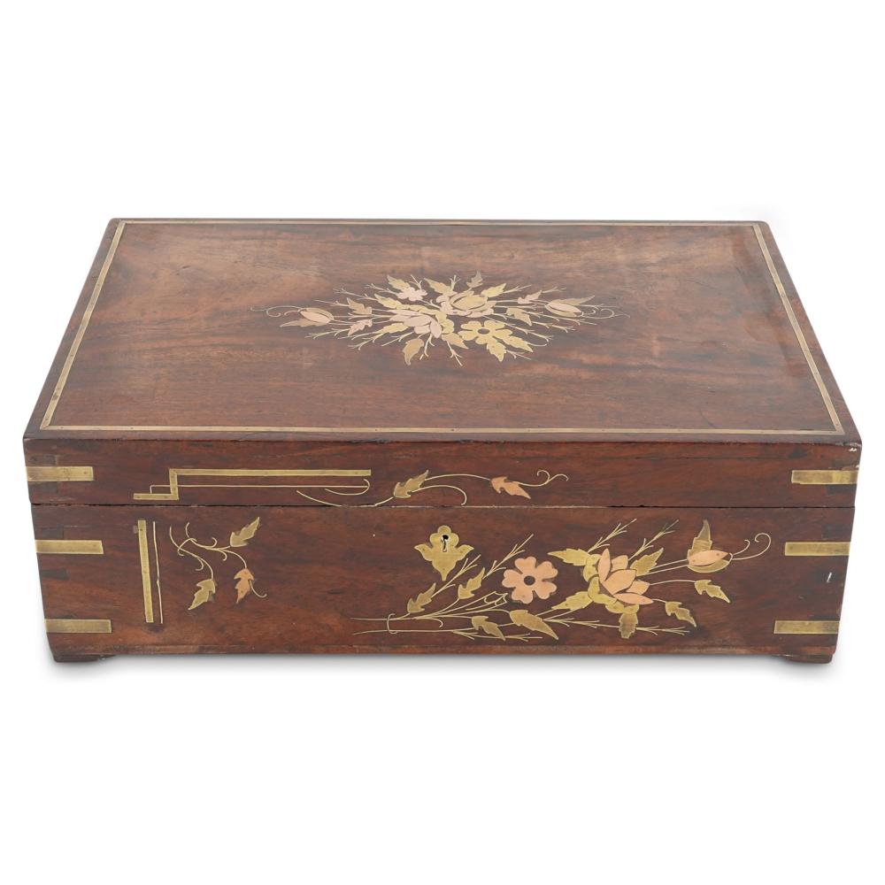 Wooden cigar box with brass inlay and floral decoration on the lid and front panel.